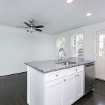 a rehab kitchen island white with grey accents
